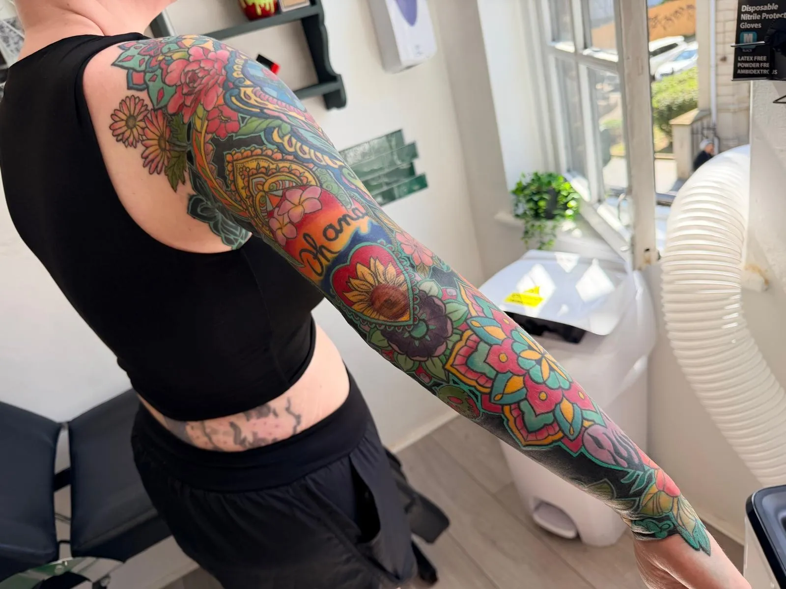 Full colour sleeve with a sunflower heart and Ohana banner